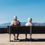 elderly people sitting on bench