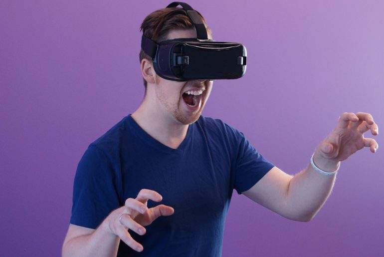 white man being a cat on VR headset