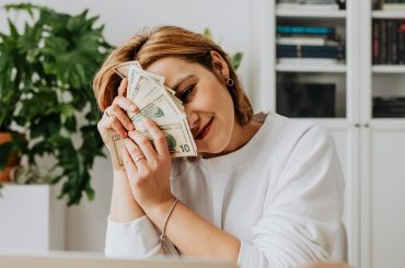 woman enjoying her extra money from hard work