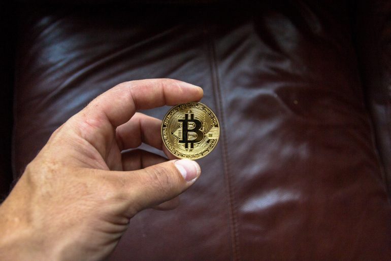bitcoin in front of leather seat