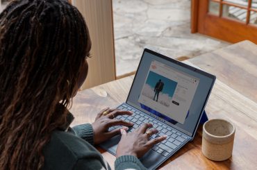 black woman guest posting on a laptop
