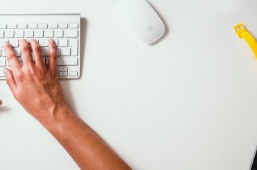 person typing on apple magic keyboard