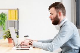 a man typing on his keyboard