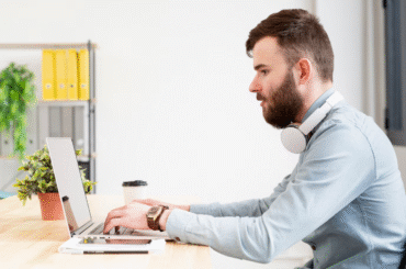 a man typing on his keyboard
