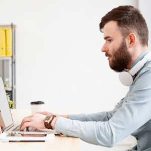 a man typing on his keyboard